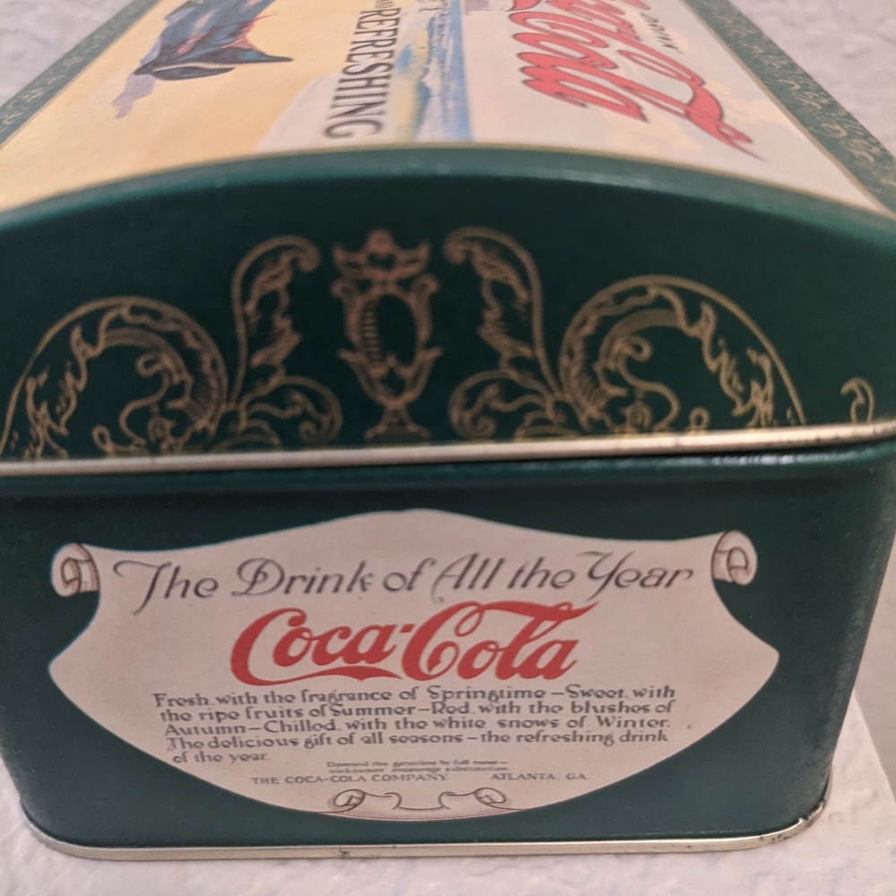 Coca Cola collectible tin box with woman on the beach on the lid.good condition